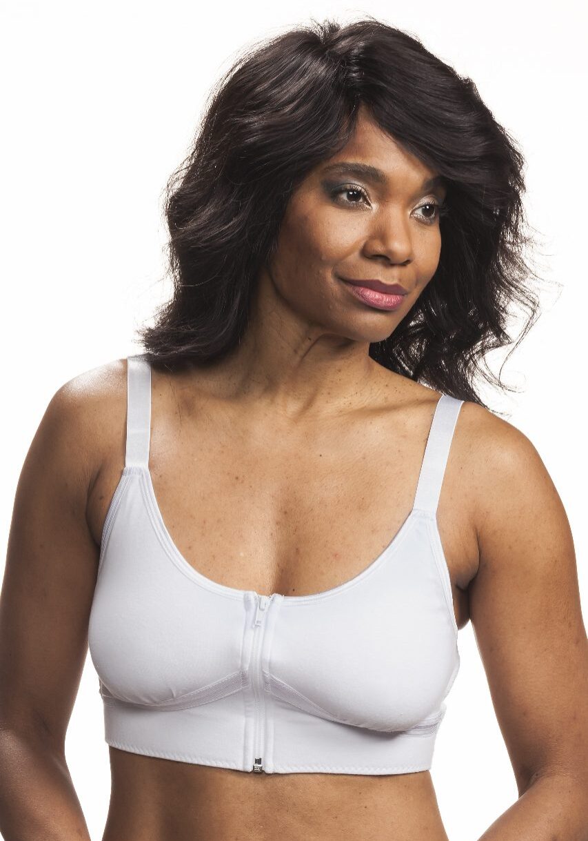 A woman in white bra posing for the camera.