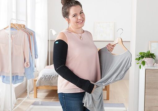 A woman holding onto some clothes in her hand