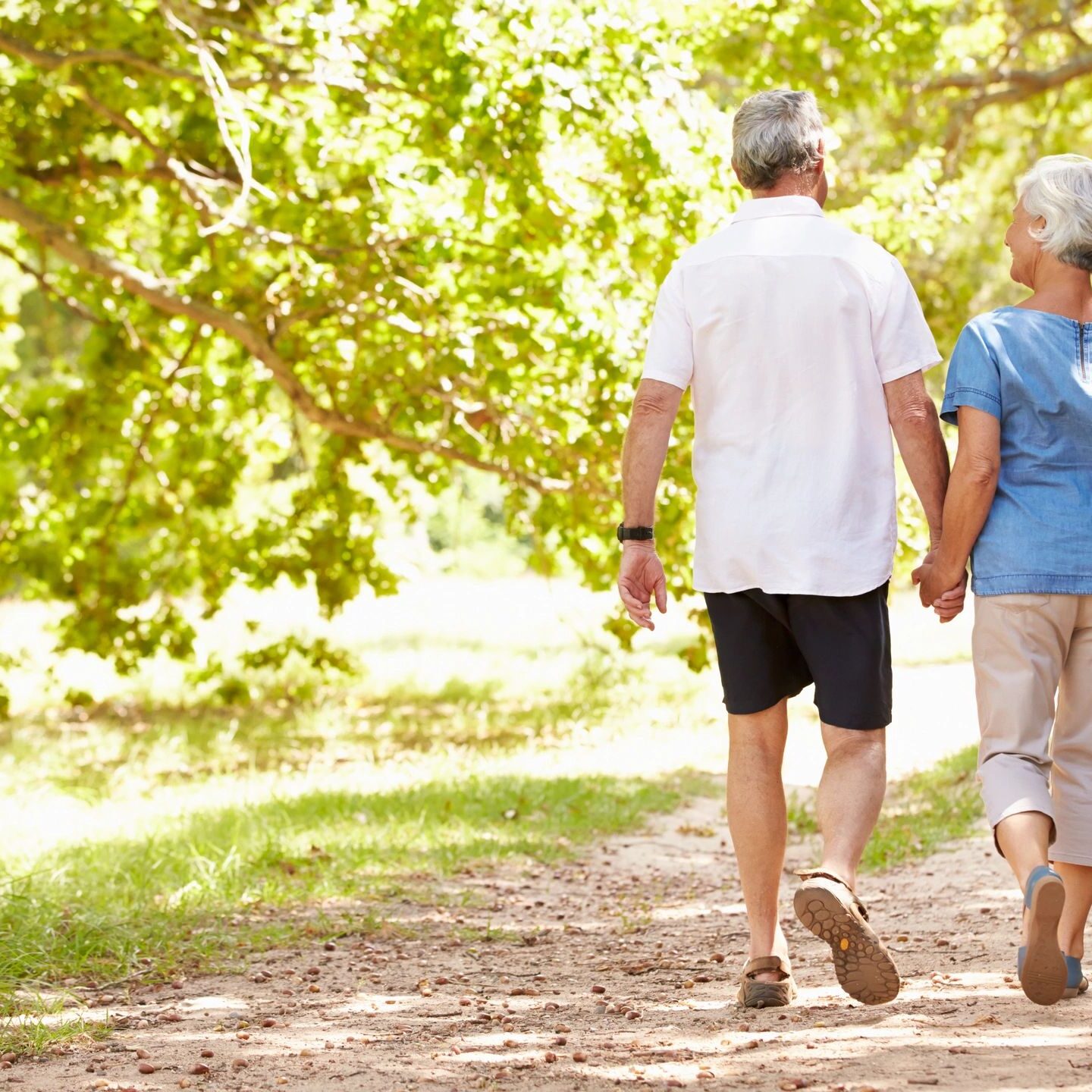 A man and woman walking on the path